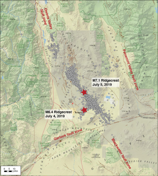 Map showing all earthquakes stronger than M2.5 in the Ridgecrest area from July 4 to August 15, 2019 (gray circles). The red stars show the location of the biggest two quakes. The Garlock Fault south of the earthquake cluster is also shown.